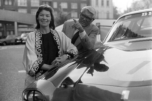 Cary Grant and Glenda Jackson standing beside car 5  /  6  /  75