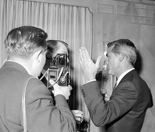 Cary Grant November1957 in London talking to journalist
