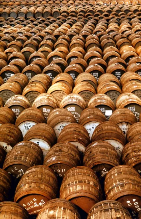 Framed Print : Empty casks used in the production of whisky awaiting filling at the Distillery