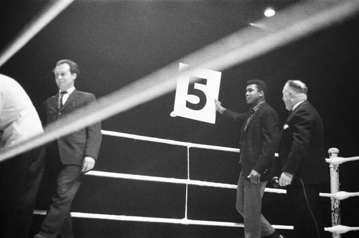 Framed Print : Cassisus Clay (Muhammad Ali) seen here holding the 5th round card during the fight Framed Print : Cassisus Clay (Muhammad Ali) seen here holding the 5th round card during the fight