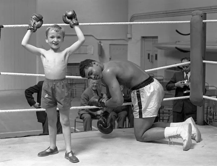 Framed Print : Cassius Clay with 6 year old Patrick Power in the ring during his training for Framed Print : Cassius Clay with 6 year old Patrick Power in the ring during his training for