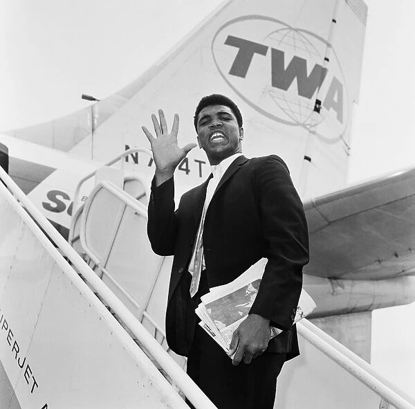 Cassius Clay, aka (Muhammad Ali) on his way back to the United States after beating