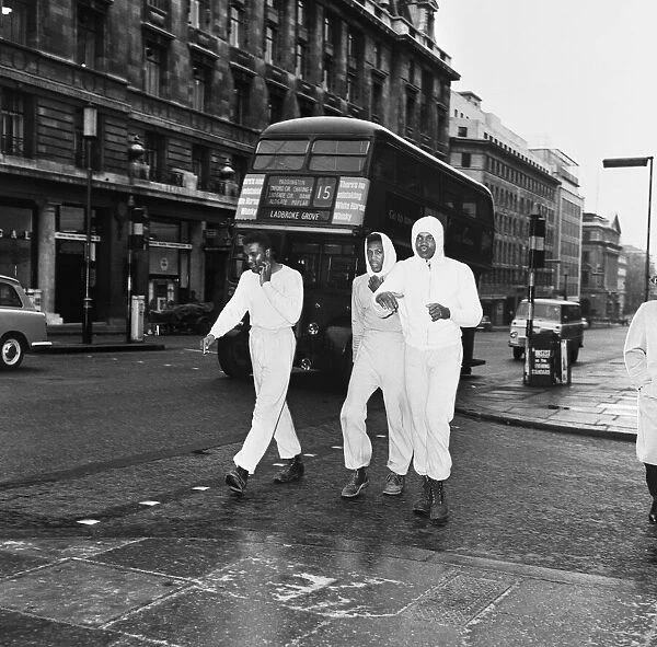 Cassius Clay aka Muhammad Ali (right) training in The Mall London ahead of his first