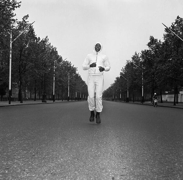 Cassius Clay aka (Muhammad Ali) running in The Mall London ahead of his first fight with