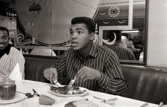 Framed Print : Cassius Clay eating Steaks at Isows restuarant in Brewer Street, Soho, London Framed Print : Cassius Clay eating Steaks at Isows restuarant in Brewer Street, Soho, London