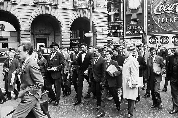 Cassius Clay and entourage walking through Regent Street on route to his press conference