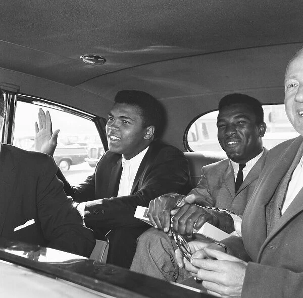 Cassius Clay left with his brother Rudoph and Jack Solomons seen here in a Rolls Royce