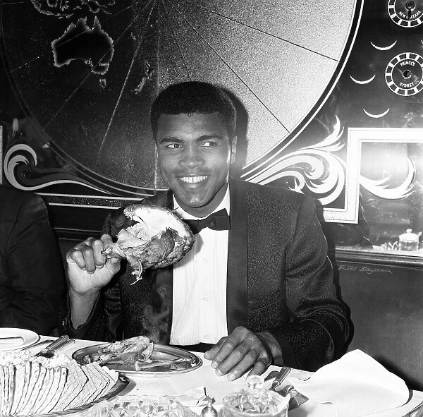 Cassius Clay (Muhammad Ali) eating chicken at Isows restaurant in Soho Brewer Street
