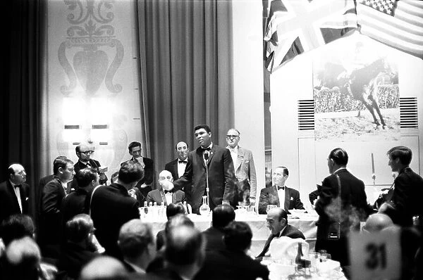 Cassius Clay (Muhammad Ali) talking into microphone, in London England ahead of his next