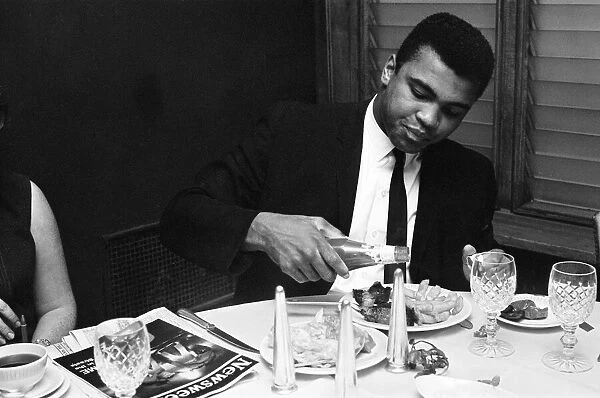 Cassius Clay (Pictured) having lunch in London before his trip to Scotland for an