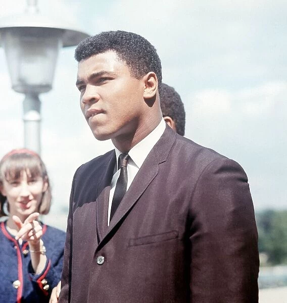 Cassius Clay watches the crowds arrive at Wembley Stadium for the World Cup final 1966