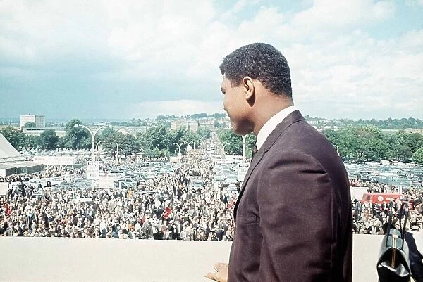Cassius Clay watches the crowds arrive at Wembley Stadium for the World Cup final 1966