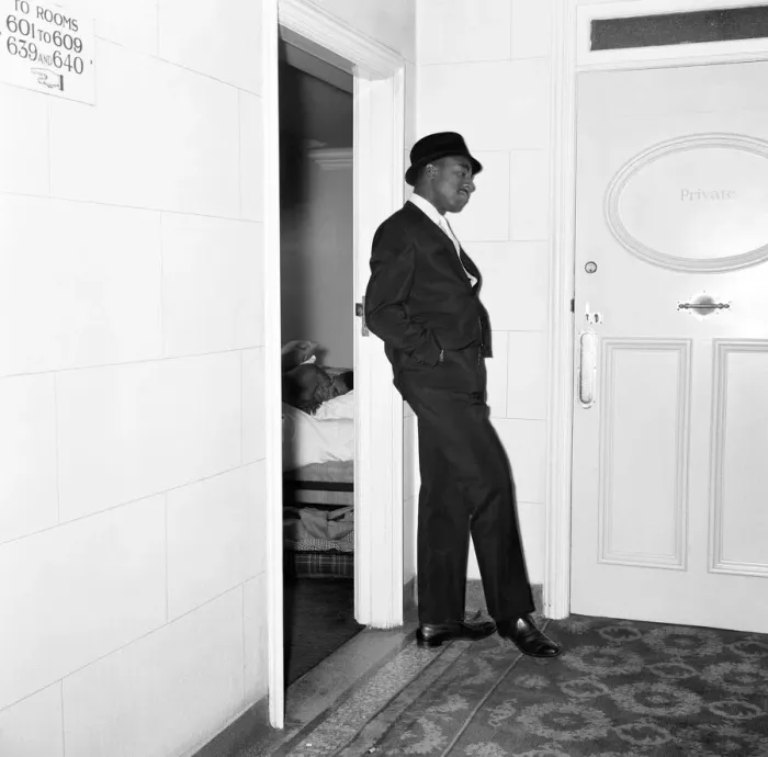 Framed Print : Cassius Clays bodyguard Ronald King keeps watch outside the Piccadilly Hotel room Framed Print : Cassius Clays bodyguard Ronald King keeps watch outside the Piccadilly Hotel room