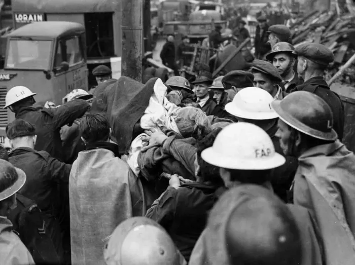 Framed Print : Casualties being removed from bombed houses in Southern England. 12th June 1944 Framed Print : Casualties being removed from bombed houses in Southern England. 12th June 1944