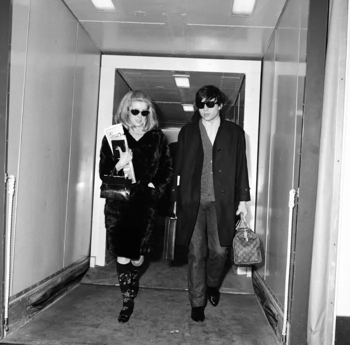 Framed Print : Catherine Deneuve, actress, and husband fashion photographer David Bailey arrive Framed Print : Catherine Deneuve, actress, and husband fashion photographer David Bailey arrive