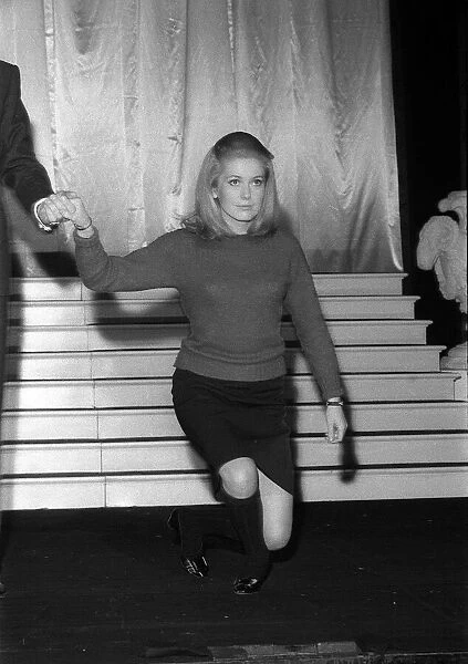 Catherine Deneuve March 1966 Curtsies on stage at the rehearsal of the Royal Film