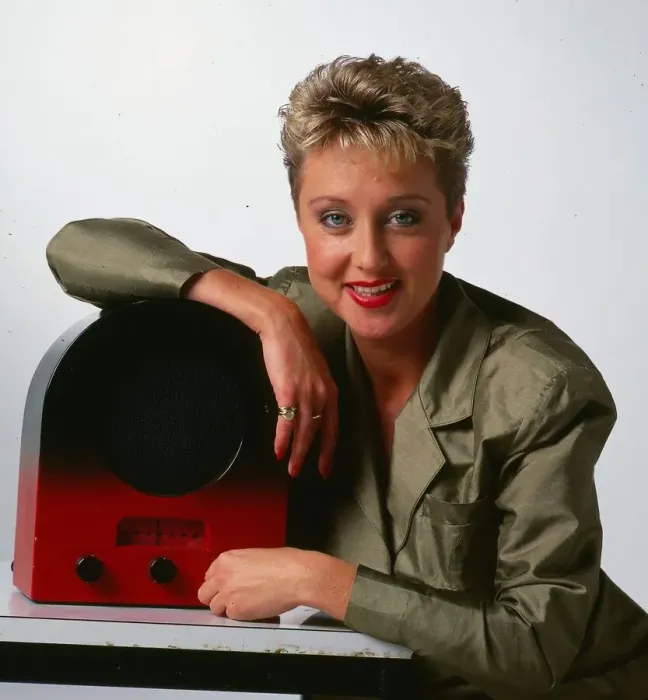Framed Print : Cathy McDonald television presenter September 1989 leaning on an old radio wireless