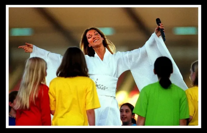 Framed Print : Celine Dion on stage at Murrayfield concert children on stage singing with her Framed Print : Celine Dion on stage at Murrayfield concert children on stage singing with her