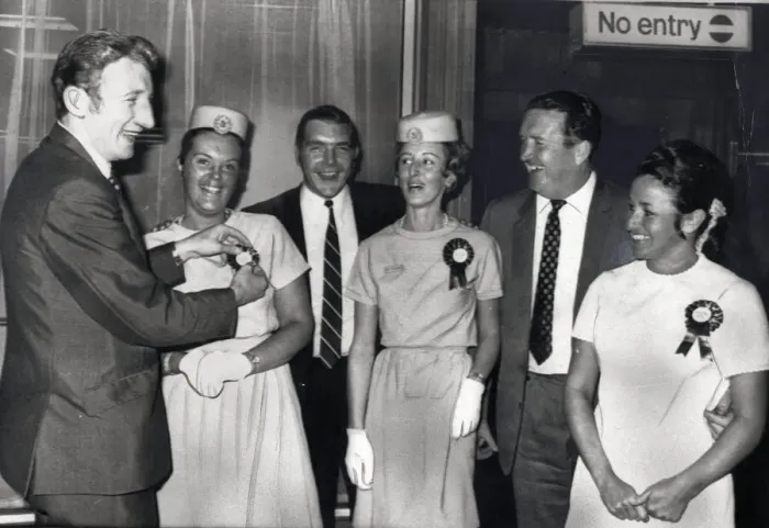 Framed Print : Celtic FC Tommy Gemmell July 1969 looks pleased as he examines the rosette worn by Framed Print : Celtic FC Tommy Gemmell July 1969 looks pleased as he examines the rosette worn by