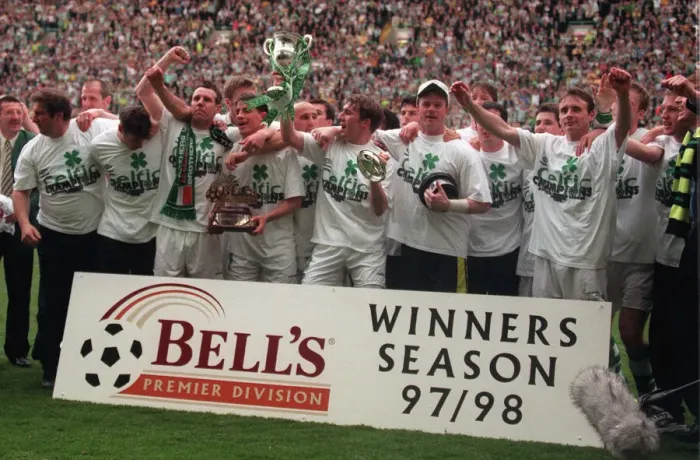 Framed Print : Celtic football players celebrate winning the championship 1998 with trophy cup winners