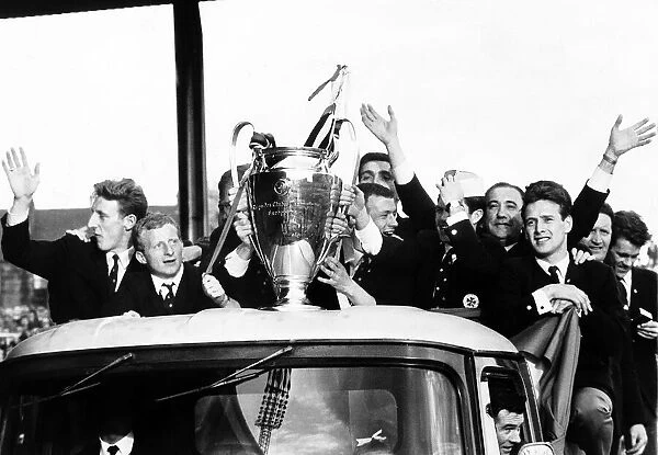 The Celtic football team parade the European Cup trophy from an open top lorry during