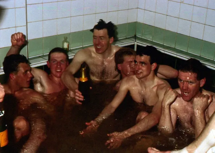 Framed Print : Celtic players celebrate in team-bath April 1988