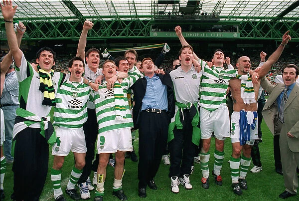 Celtic players celebrate winning the league championship 1998