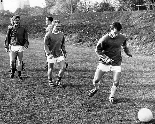 Celtic Striker Bobby Lennox in training, practicing his sprint and shoot