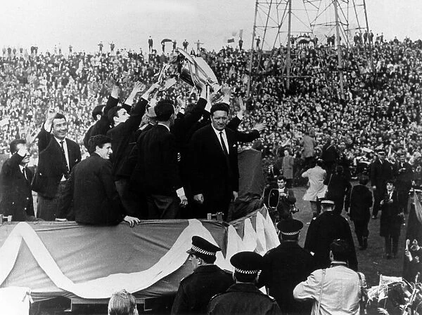 The Celtic team led by their manager Jock Stein, parading the European Cup trophy at