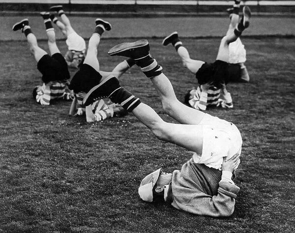 Celtic training, Charlie Tully limbers up. Circa 1955