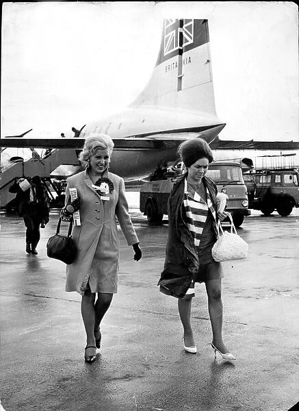 Celtic wives fly home to Prestwick Airport, Scotland, and into the rain