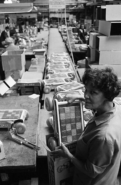 Chad Valley Toy company, Birmingham, West Midlands. Pictured packing baby walkers is Mrs