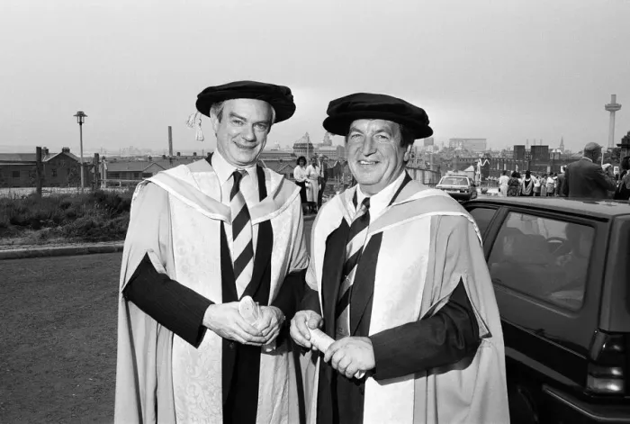 Framed Print : Former chairman of Next George Davies, shows off his robes for the degree ceremony of