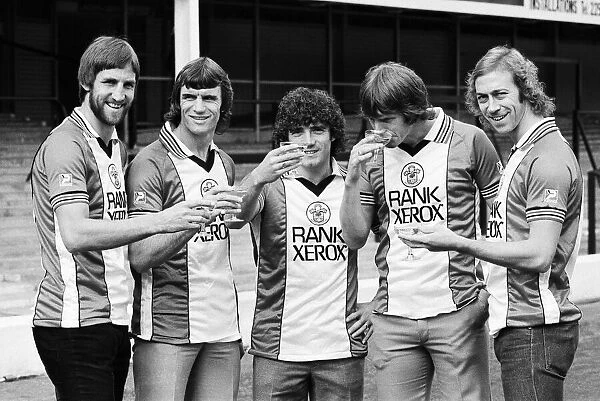 A champagne toast for Southampton FC players wearing their new Rank Xerox sponsored