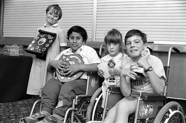 Champion... disabled children from the area were presented with swimming awards at their