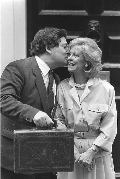 CHANCELLOR OF THE EXCHEQUER, NIGEL LAWSON WITH HIS WIFE THERESE ON BUDGET DAY OUTSIDE