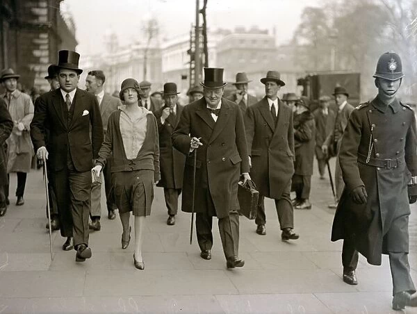 Chancellor of the Exchequer Winston Churchill carrying his dispatch case on his way to