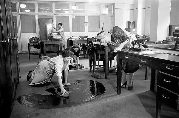 Charladies seen here cleaning the offices of city bankers whilst the square mile sleeps