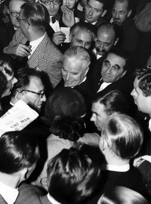 Framed Print : Charlie Chaplin Actor surrounded by people in a crowd