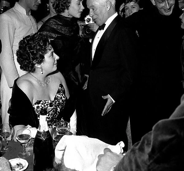 Charlie Chaplin actor talks with Countess Rosenberg at the Ice Ball in Paris