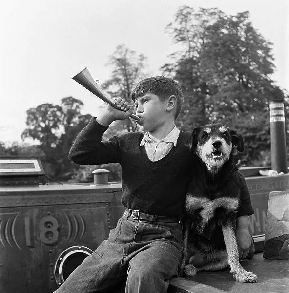 Charlie Collins, age 10, son of the captain of the canal boat '