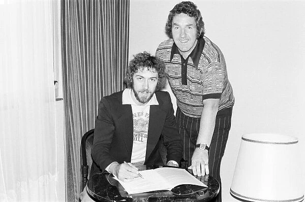 Charlie George signs for Derby County at a London hotel, with manager Dave Mackay