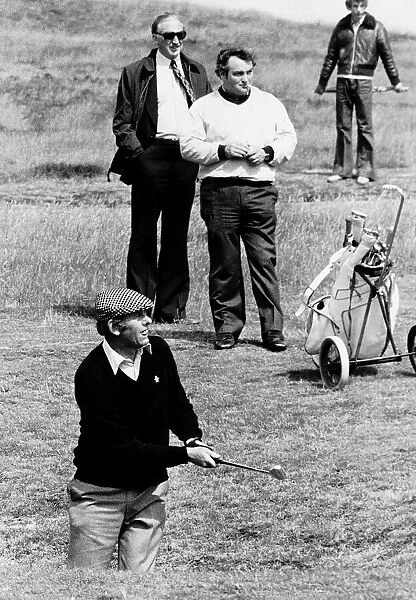 Charlie Green pictured just after hitting ball Brian Aitken in background golf