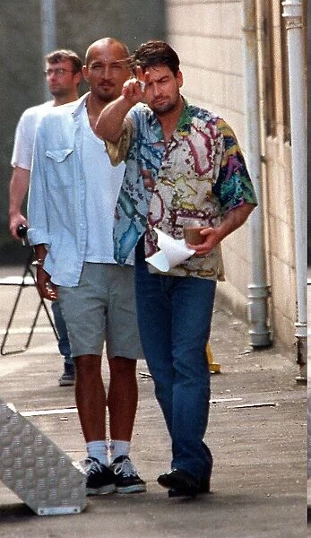 CHARLIE SHEEN ACTOR FILMING JULY 1996 AT CLYDEBANK TOWN HALL NEAR GLASGOW WITH CUP