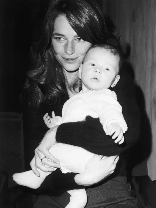 Framed Print : Charlotte Rampling - January 1973 At Heathrow Airport with her baby Barnaby Framed Print : Charlotte Rampling - January 1973 At Heathrow Airport with her baby Barnaby