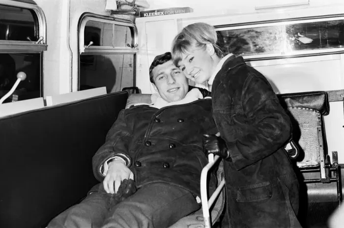 Framed Print : Charlton Athletic footballer Mike Bailey returns to London with his wife after breaking