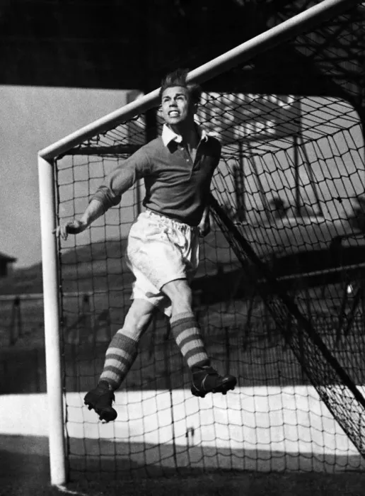 Framed Print : Charlton Athletic left half Bert Johnson practicing heading the ball out from under