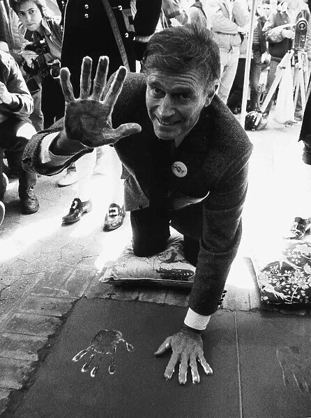 Charlton Heston Actor putting his hand prints in cement at Star Pavement in London