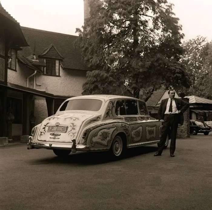 Framed Print : The chauffeur of The Beatles singer John Lennon standing beside Lennon