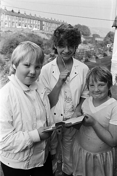 Checking the clues before setting out on a treasure hunt at Marsden are (from left
